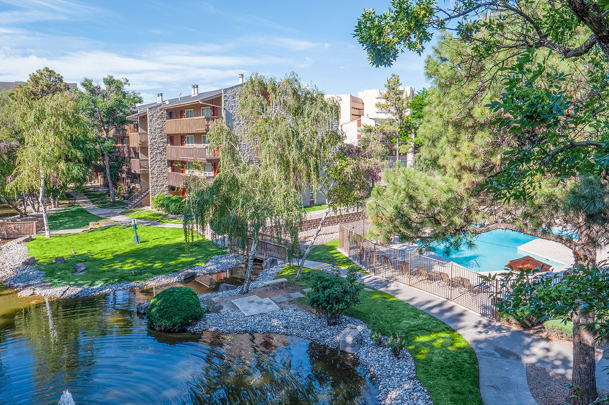 View of pond, pool and Pearl Apartments